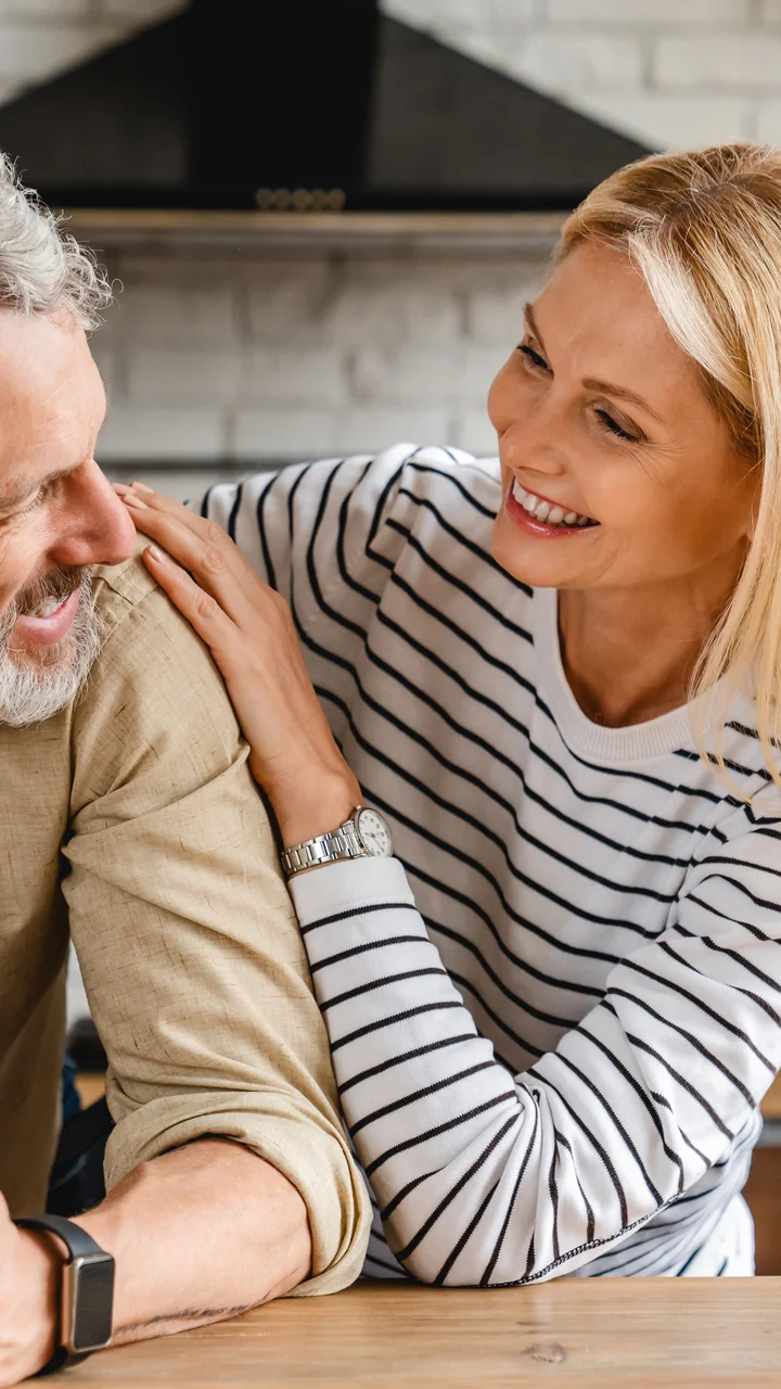 Mature couple sharing an affectionate moment in their kitchen